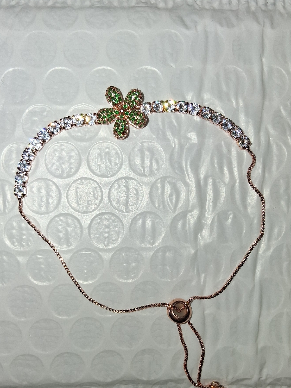 Rose Gold Tone With Spinning Green Gem Flower.upto Size 9. Nwt